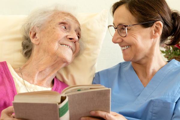 nurse and patient reading